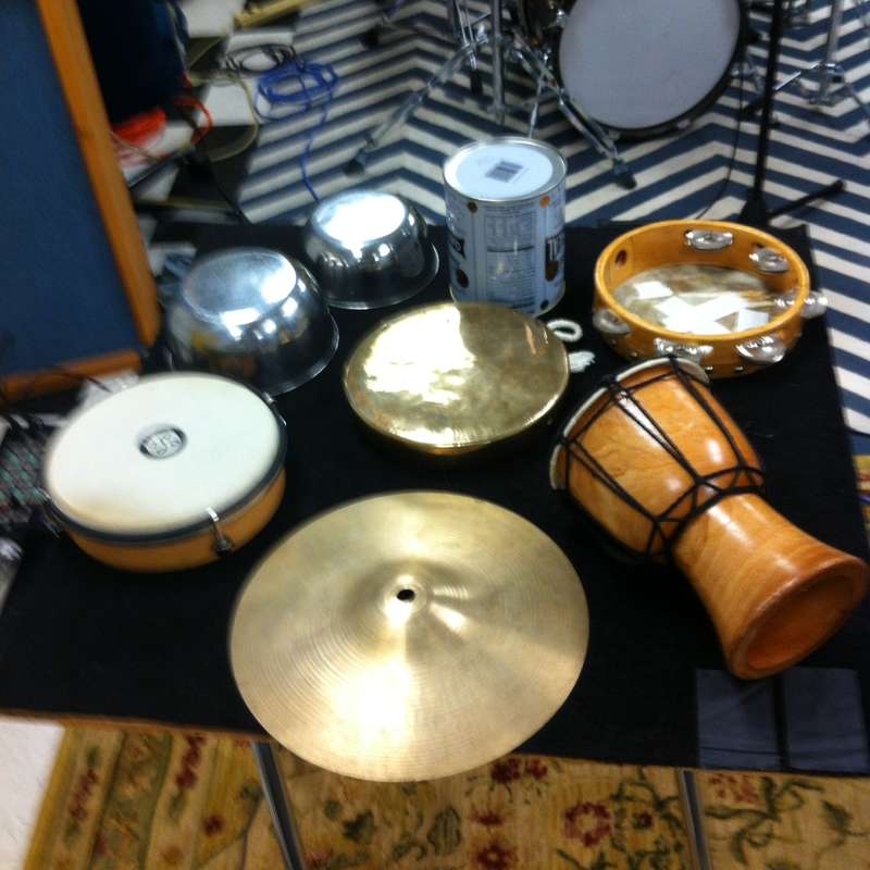 Tabletop with bass drum in the background 